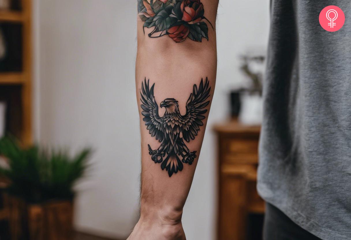 Man with traditional Polish eagle tattoo on forearm