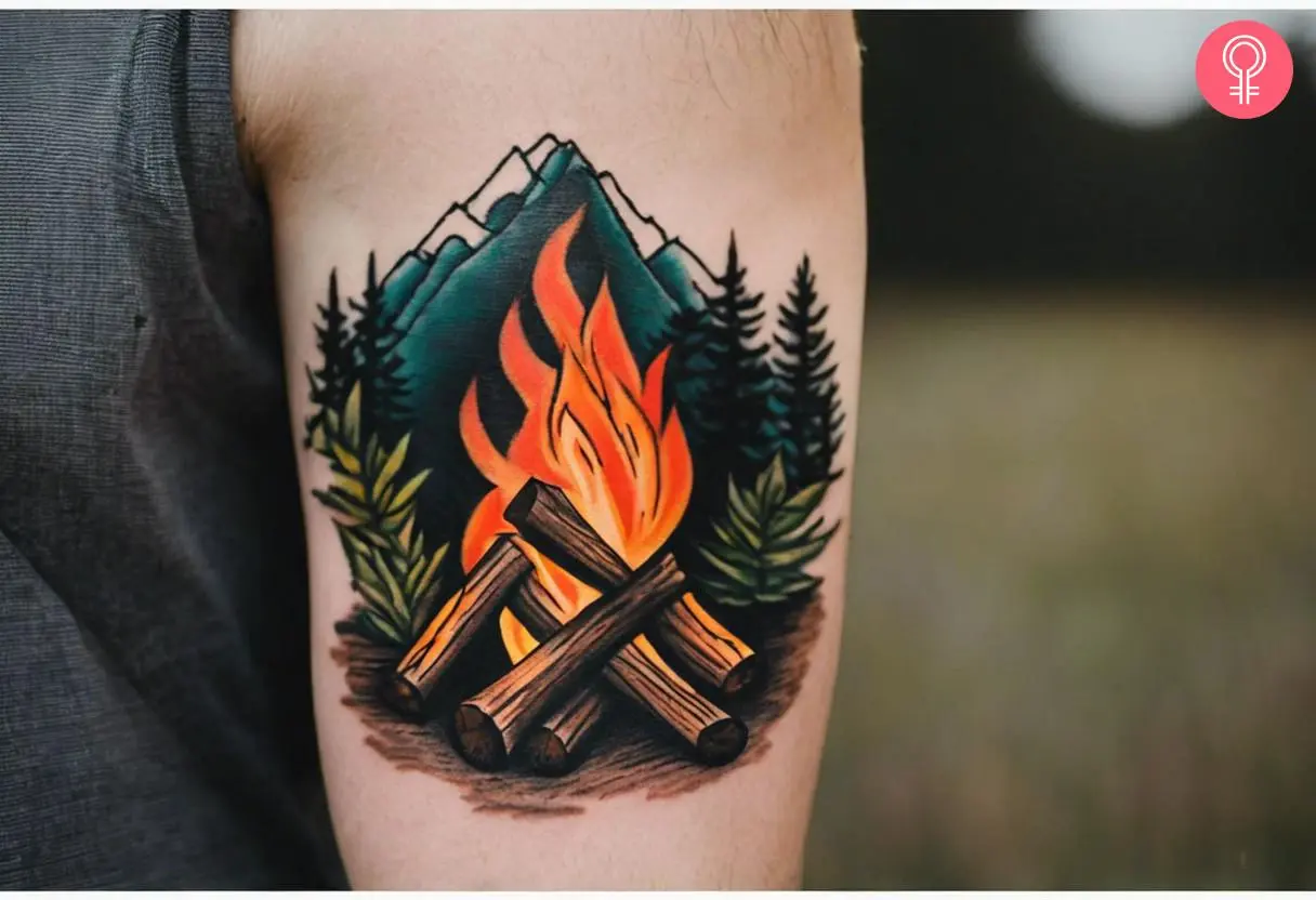 Man with traditional campfire tattoo on his upper arm