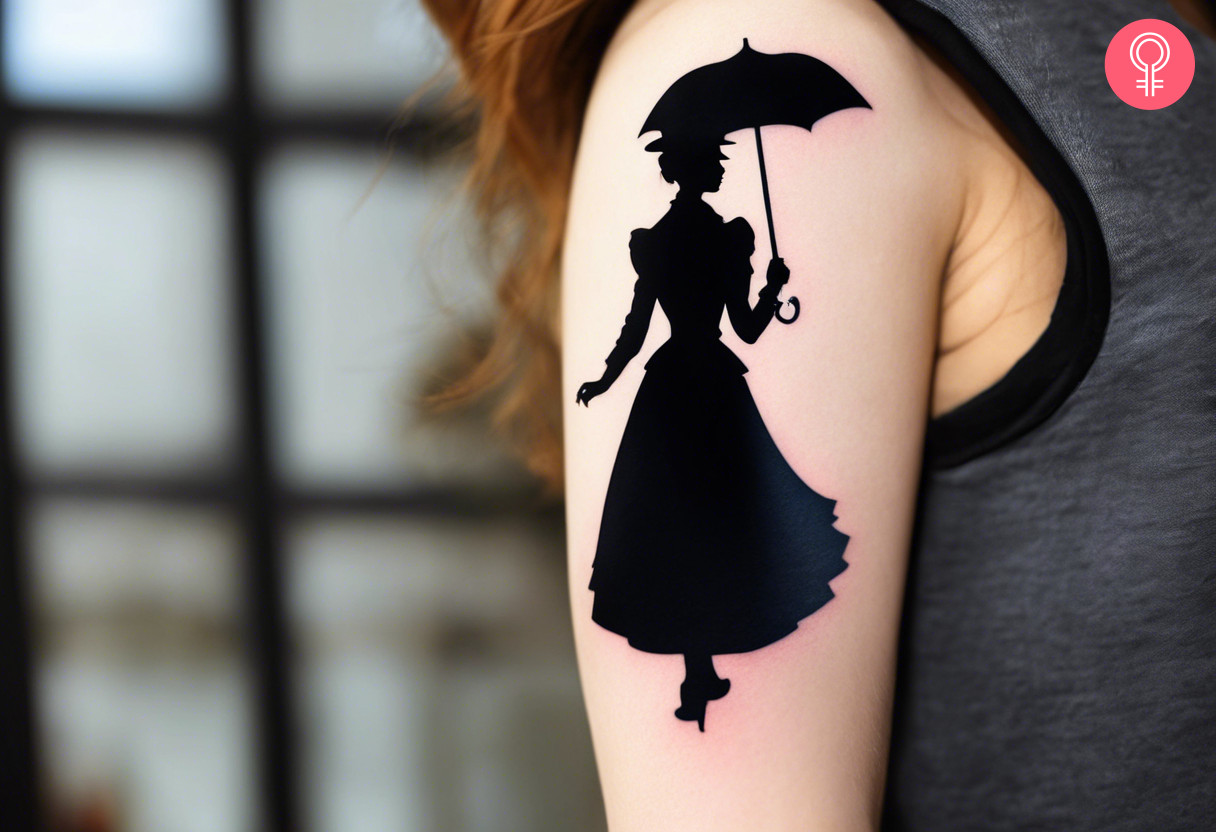 A woman with a black Mary Poppins silhouette tattoo on her upper arm