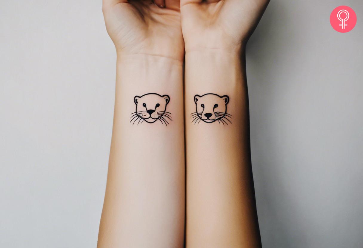 Line art matching otter tattoos on the wrist