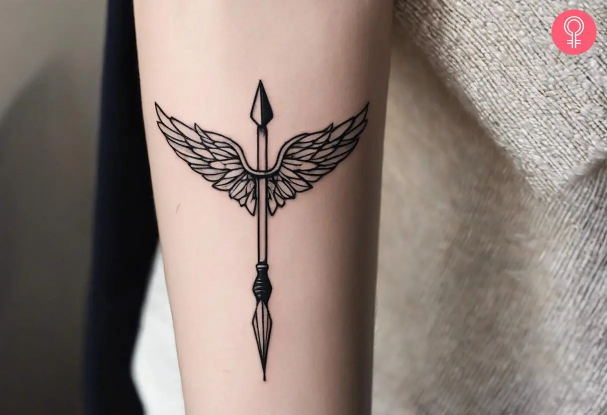 Woman with a memorial dart tattoo on the forearm