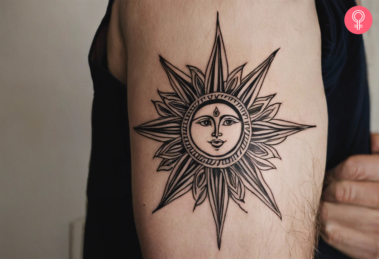 Men with sun tattoo on his outer arm