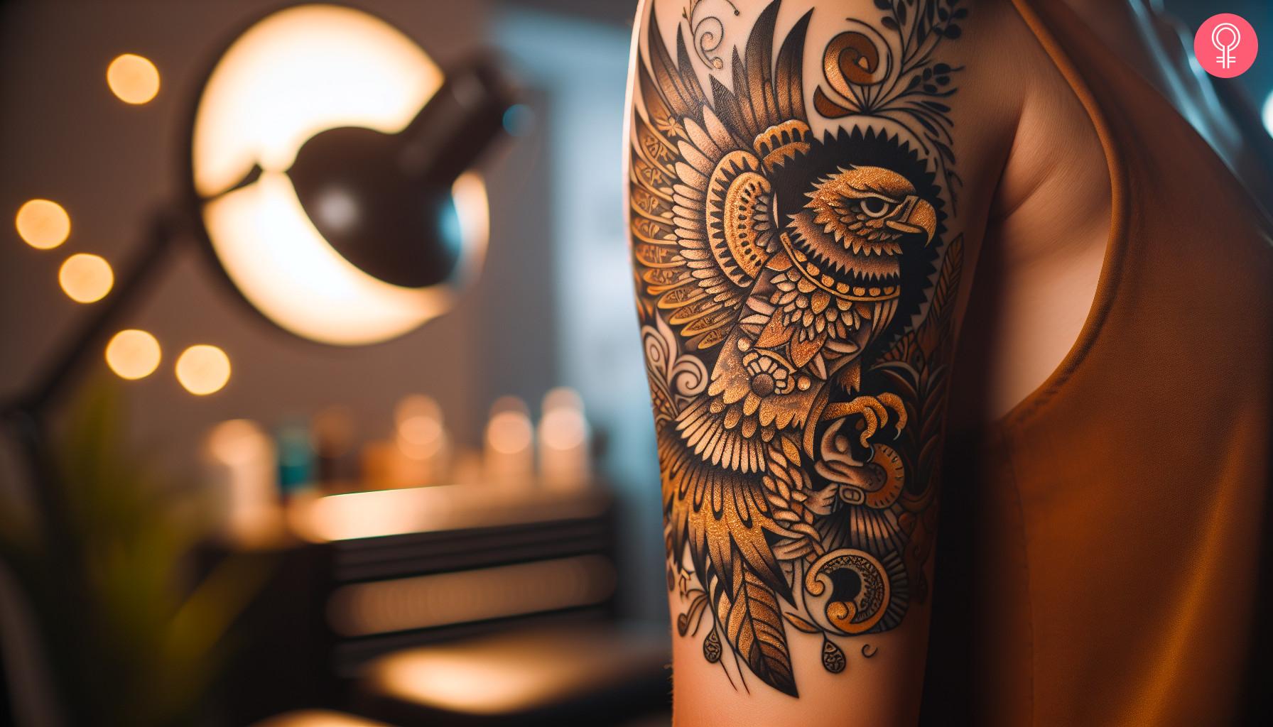 Mexican golden eagle tattoo on the arm of a woman