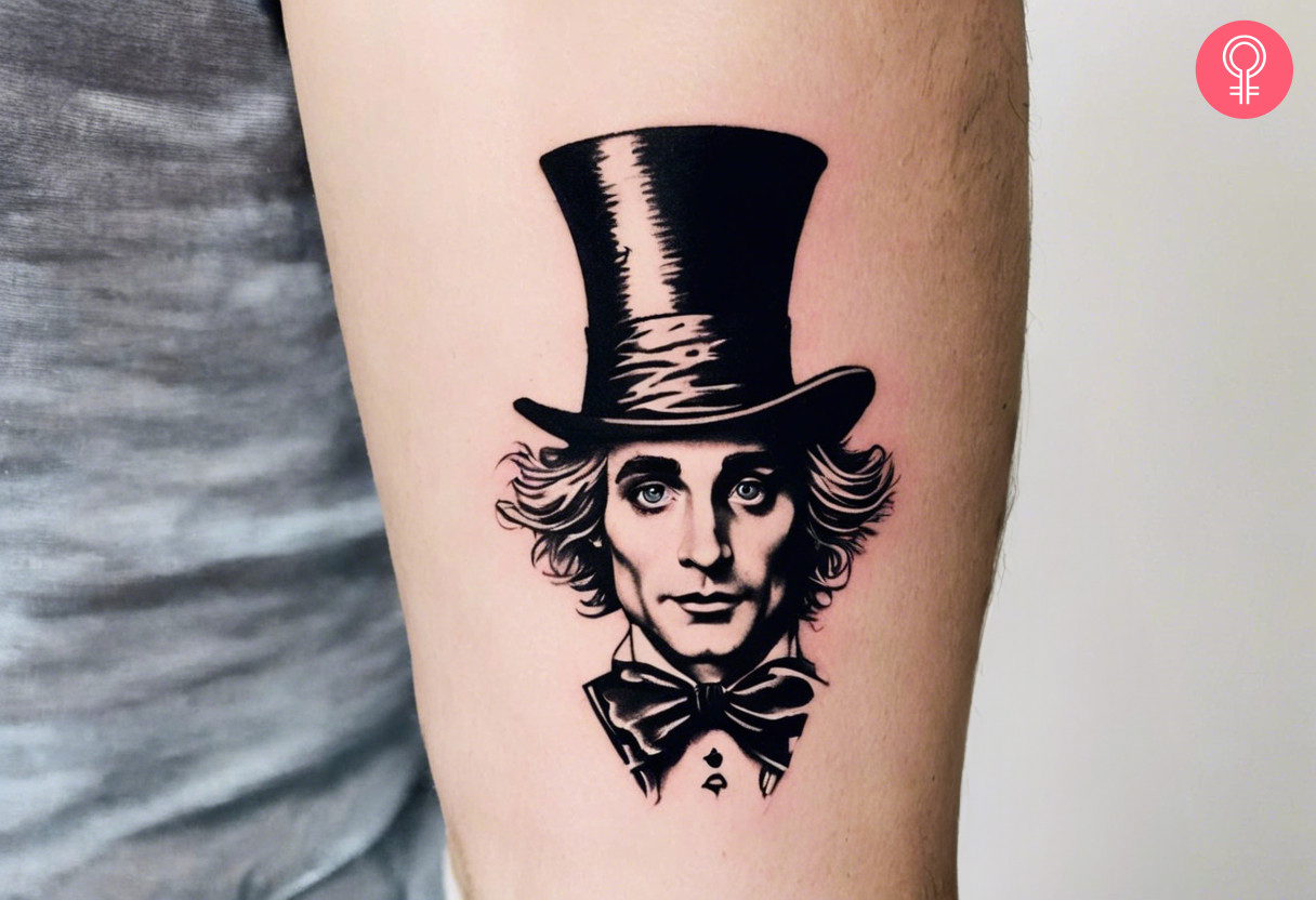 Minimalist 'Alice In Wonderland' tattoo on a woman’s arm