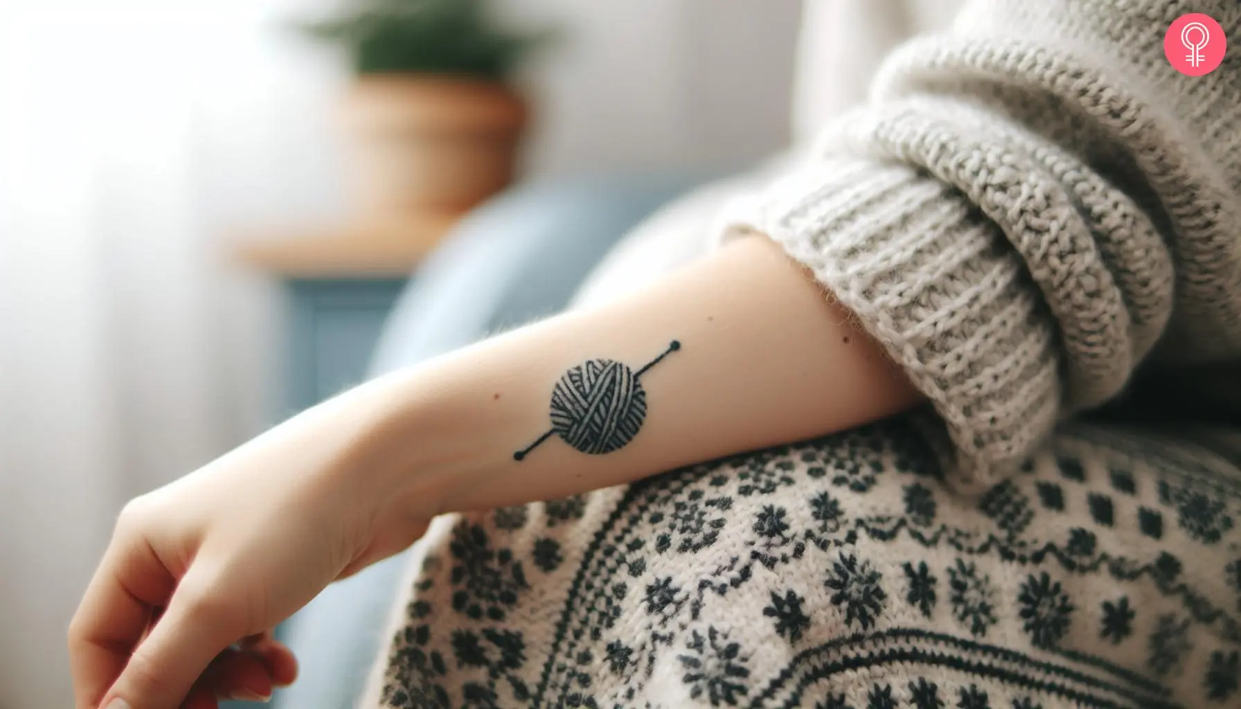 A minimalist crochet tattoo on a woman’s forearm