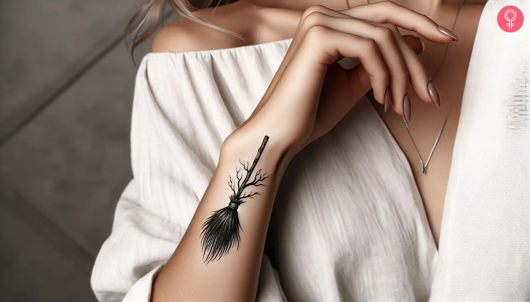 Woman with minimalist witch broom tattoo on her wrist