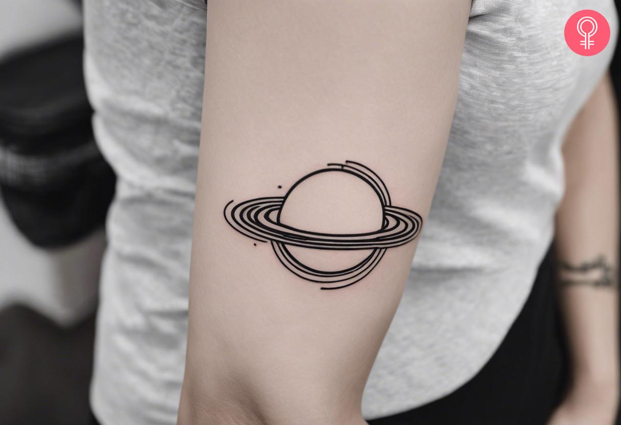 Minimalist celestial tattoo on upper arm