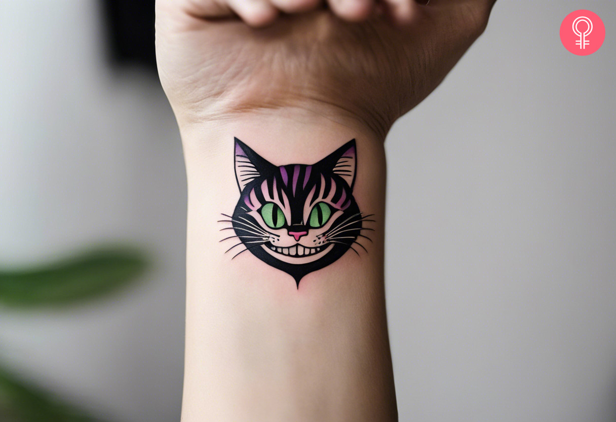 Minimalist cheshire cat tattoo on the wrist