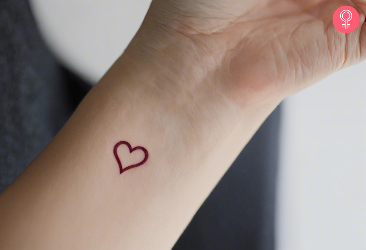 Minimalist heart tattoo on the wrist