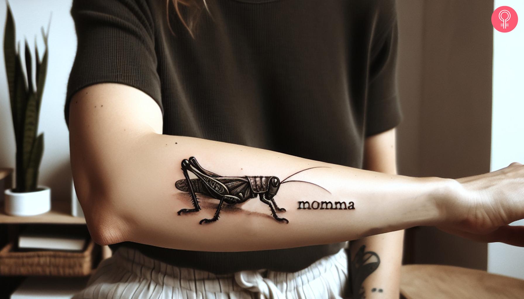 A mother grasshopper tattoo on the forearm