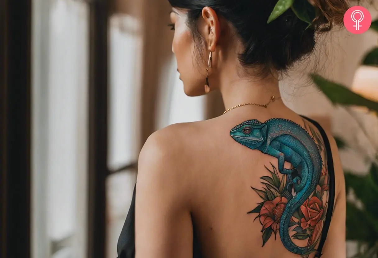 A neo-traditional chameleon tattoo on a woman’s back