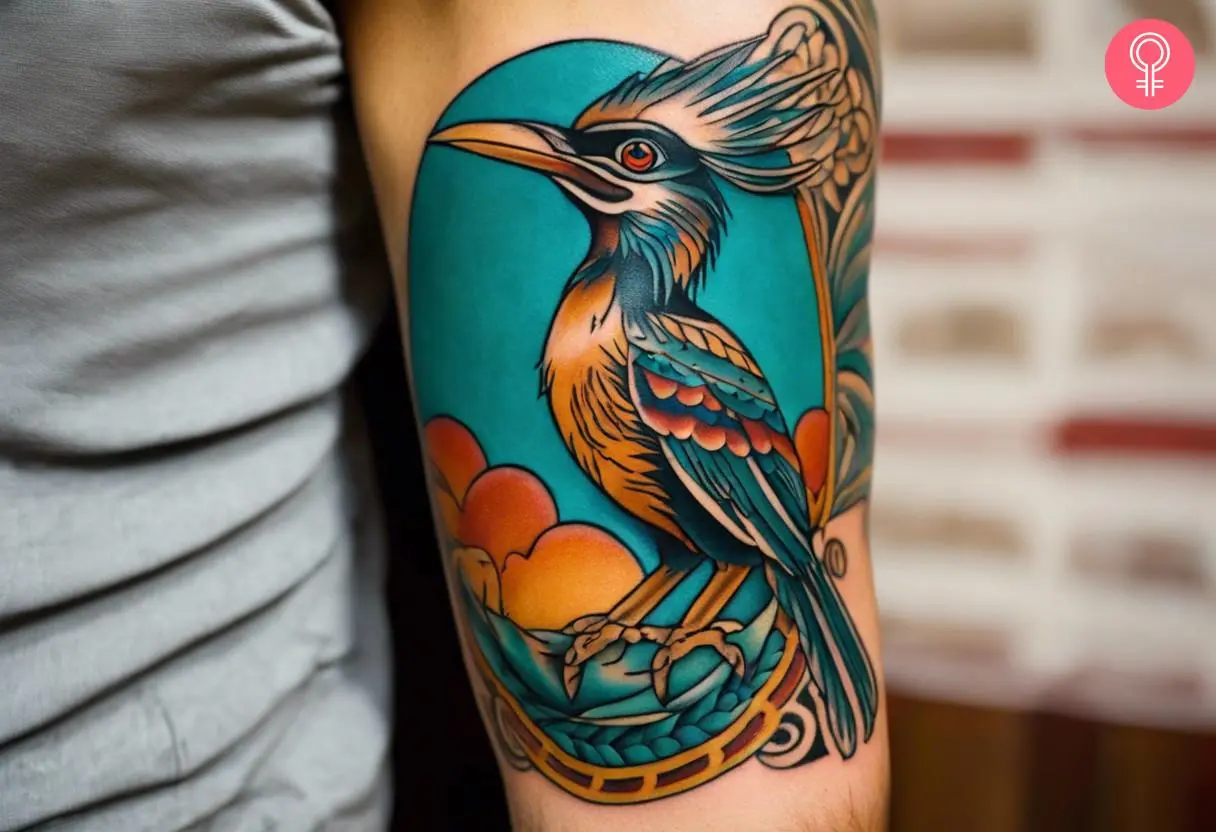 A man wearing a New Mexico roadrunner tattoo on the lower arm.