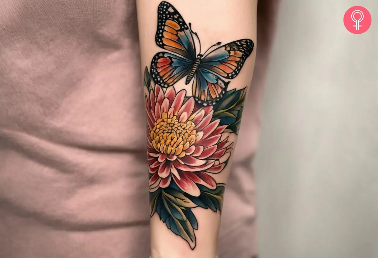 A chrysanthemum with a butterfly inked on the forearm