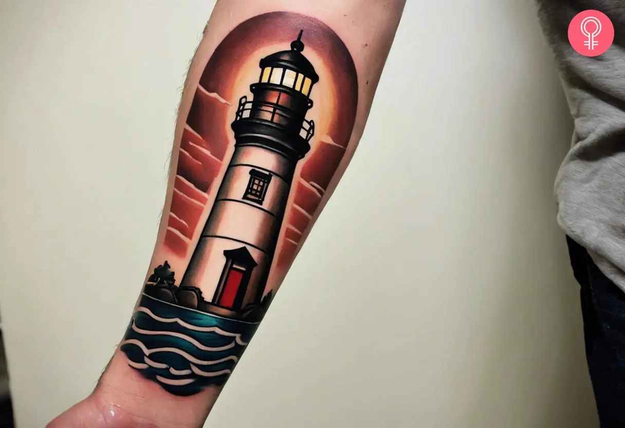 A scenic lighthouse tattoo on the forearm