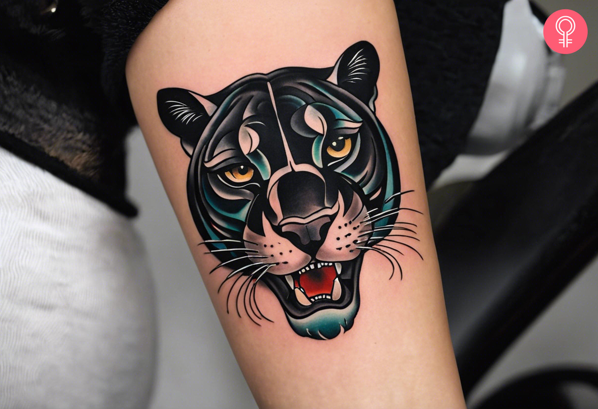 An old school panther tattoo on a woman’s forearm