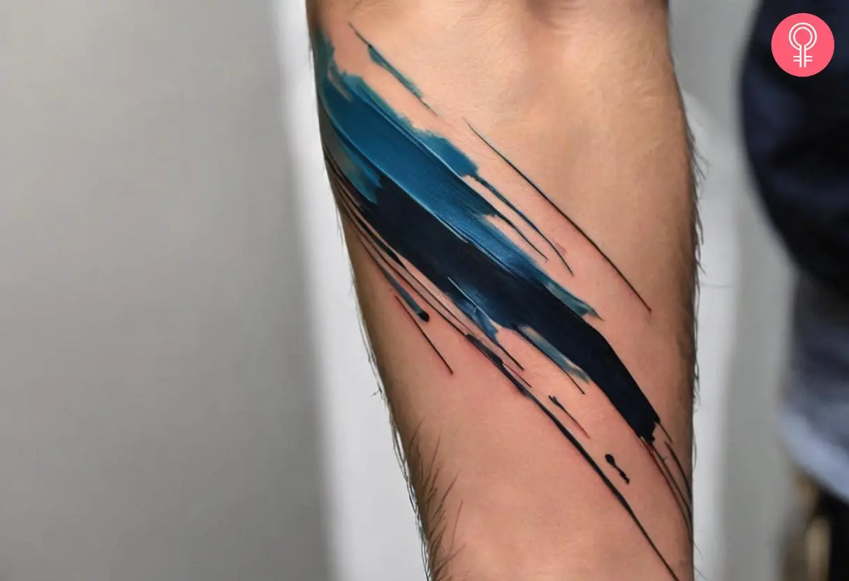 Paint brush stroke tattoo on the forearm