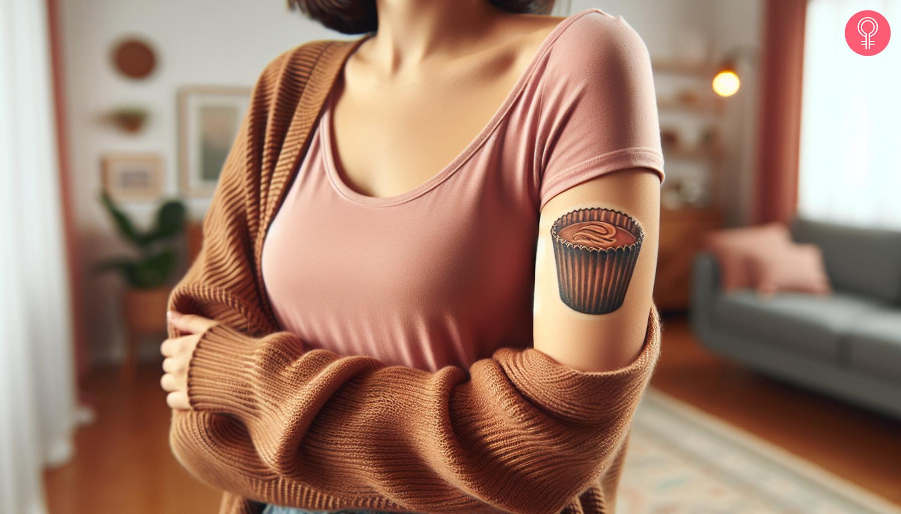 Peanut butter cup tattoo on the upper arm