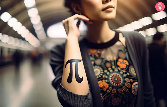 Pi symbol tattoo on the forearm of a woman