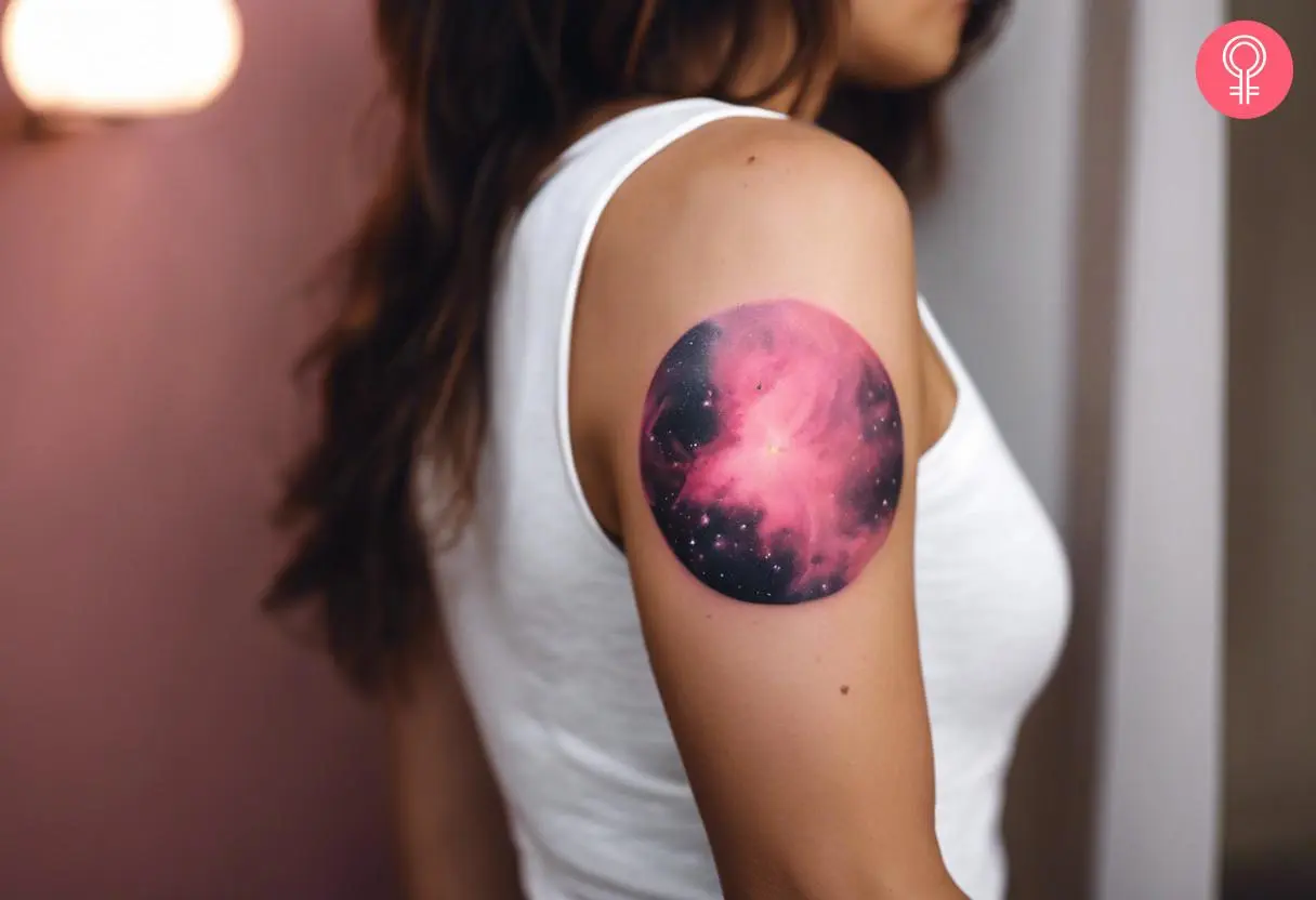 Pink Nebula tattoo on the upper arm