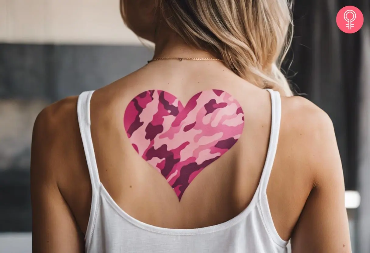 Pink camo heart tattoo on the back shoulder