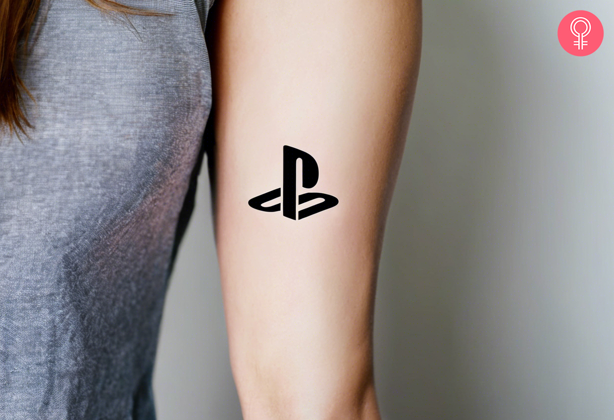 A PlayStation logo tattoo on a woman’s arm