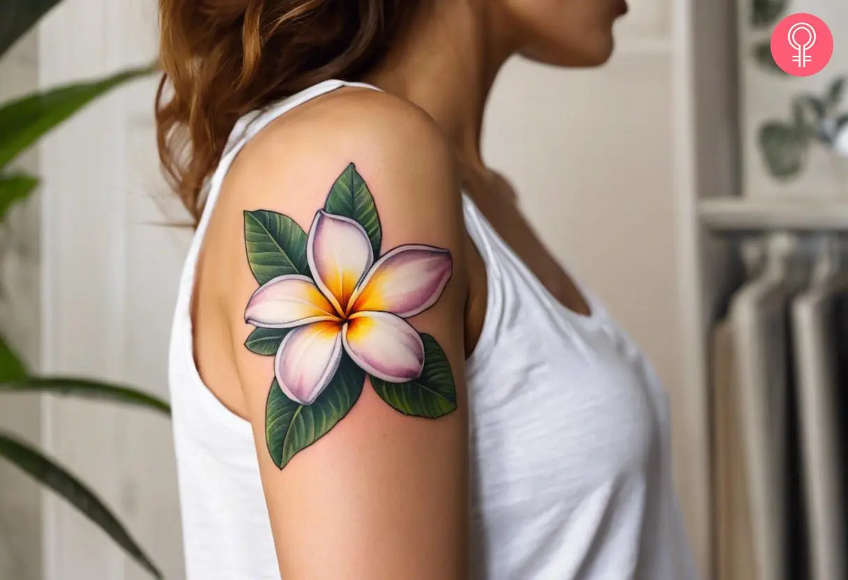 Plumeria Flower tattoo on the upper arm