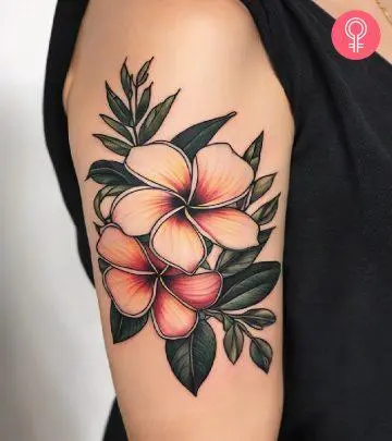 Plumeria tattoo on the upper arm