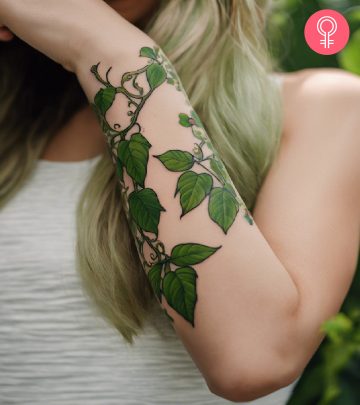 Woman with a minimalist worm tattoo on the forearm