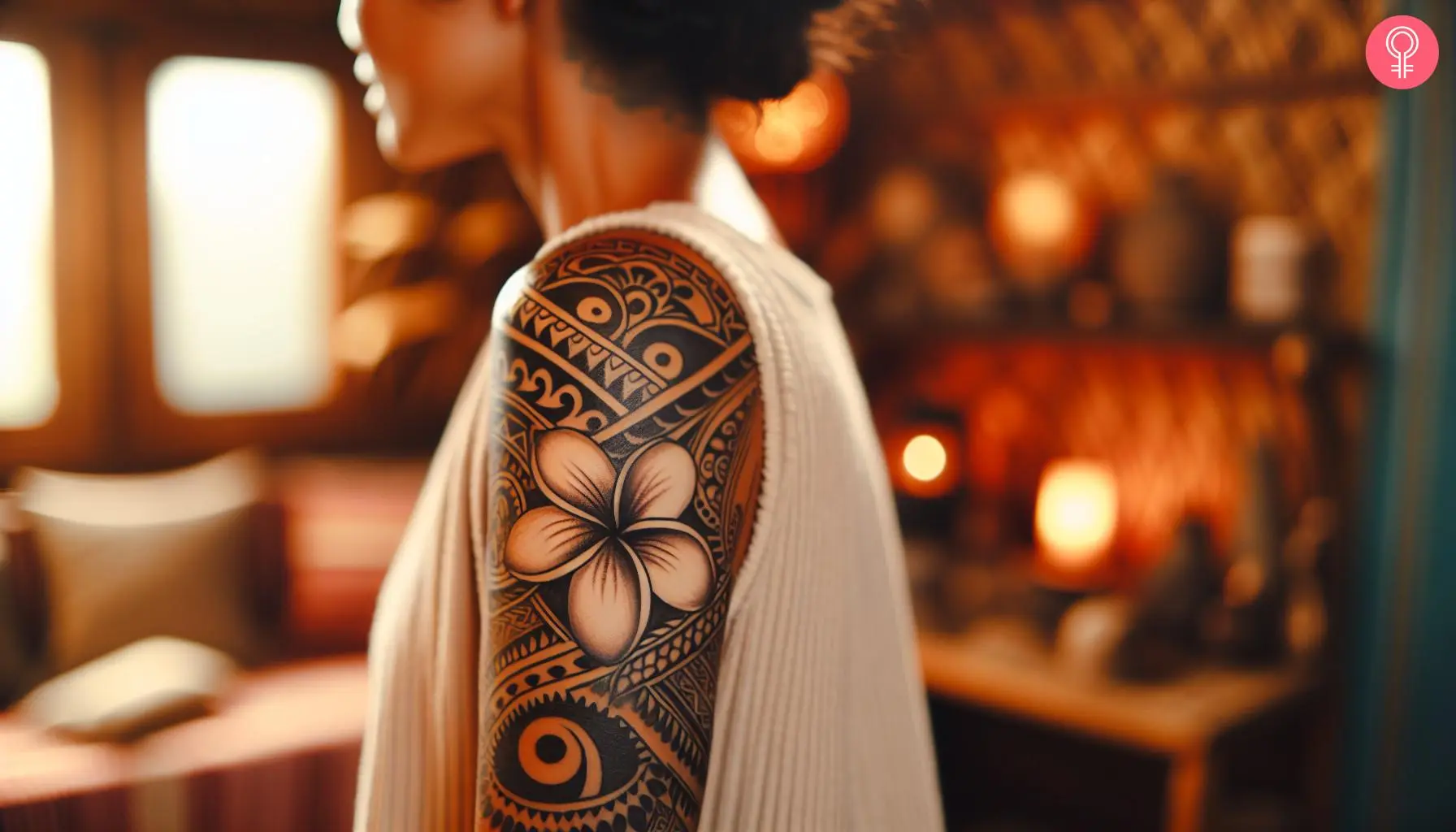 Polynesian plumeria tattoo on the upper arm