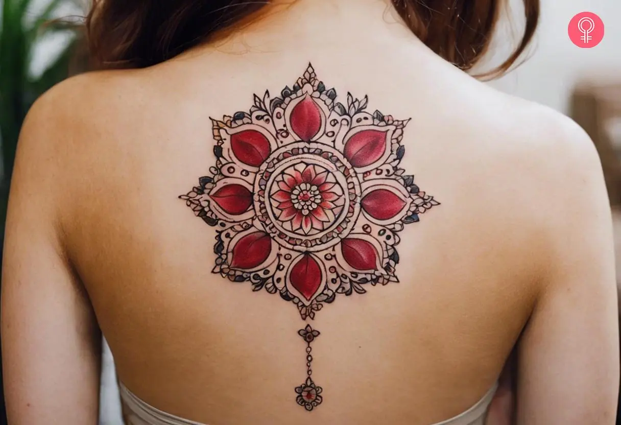 Pomegranate mandala tattoo on a woman's back