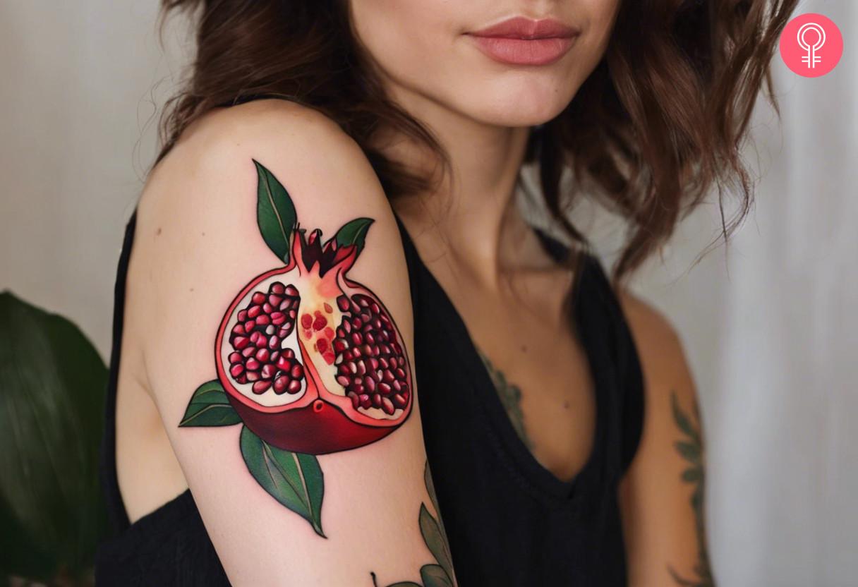 Pomegranate seed tattoo on a woman's arm