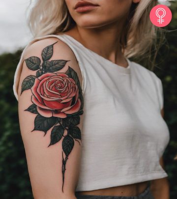 A victory tattoo on the upper arm of a woman