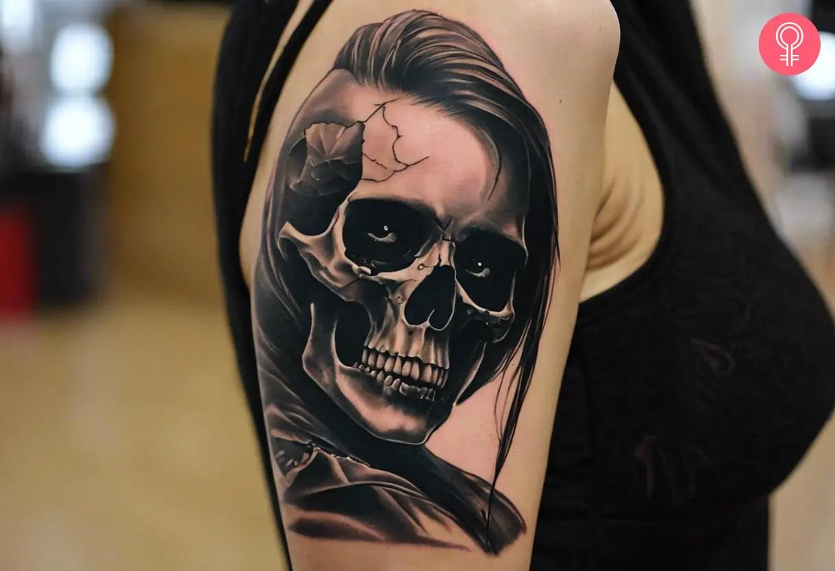 Punk skull tattoo on a woman’s upper arm