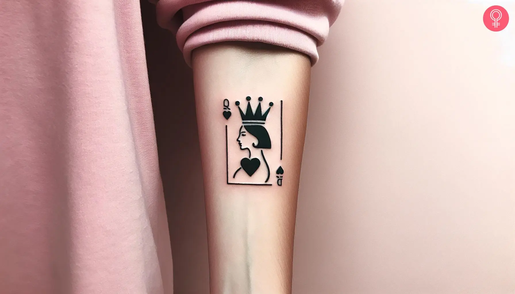 Woman with Queen of Hearts tattoo with crown on her forearm