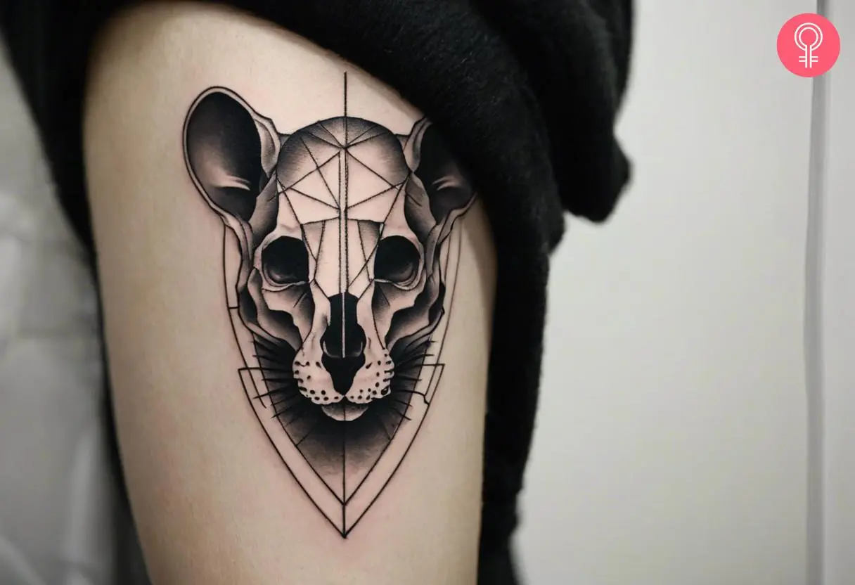 Rat skull tattoo on the upper arm