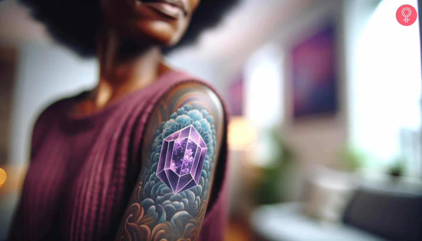 A woman with a realistic amethyst tattoo on her upper arm