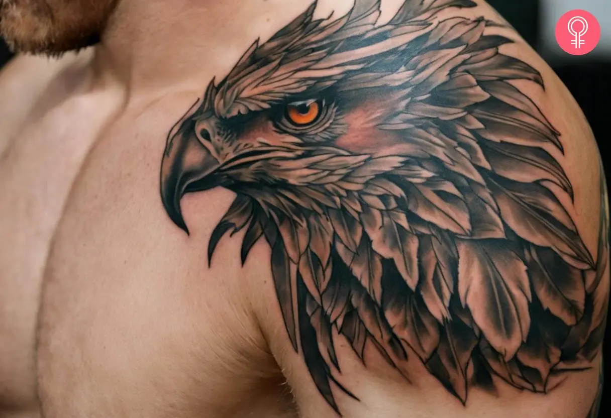 A realistic griffin head tattoo on a man’s shoulder