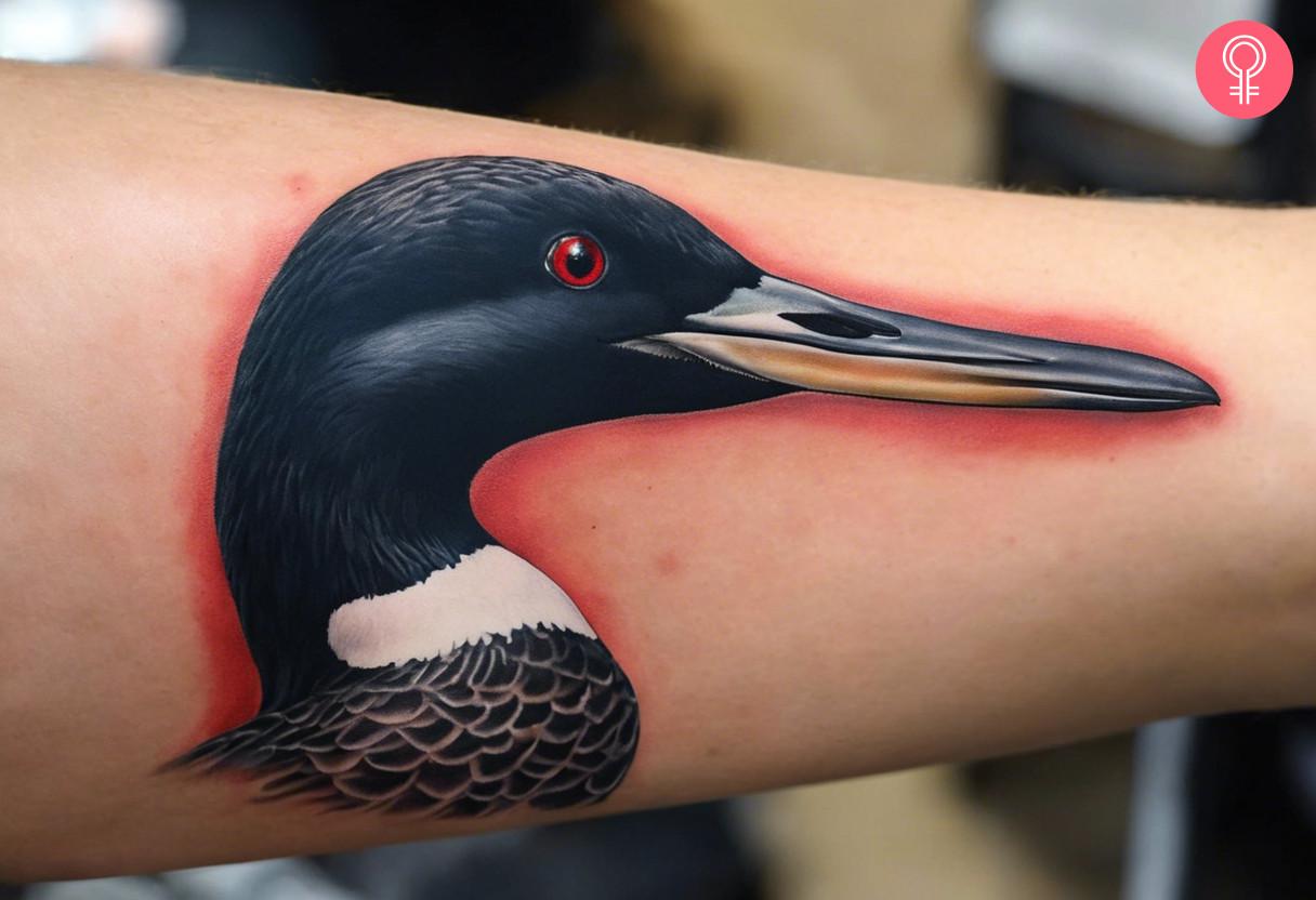 A realistic diver tattoo on the forearm