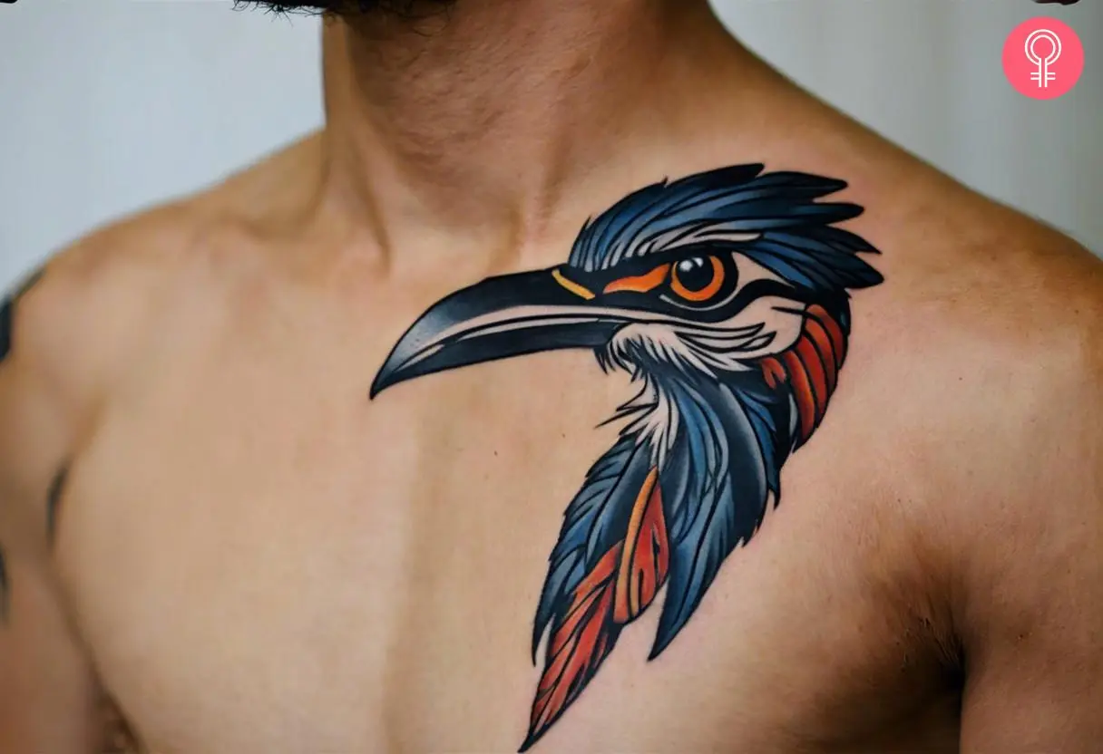 A man wearing a roadrunner feather tattoo on the chest.