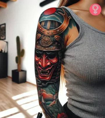A woman with a Oni mask tattoo on her arm