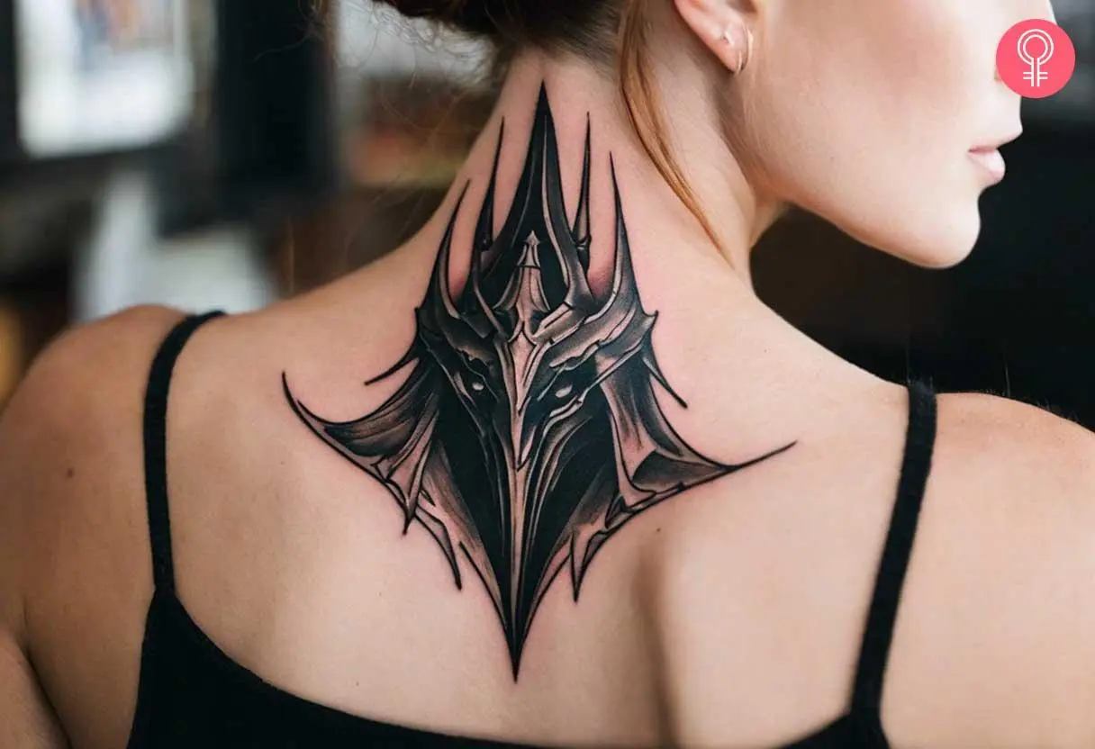 Sauron helmet tattoo on the upper back