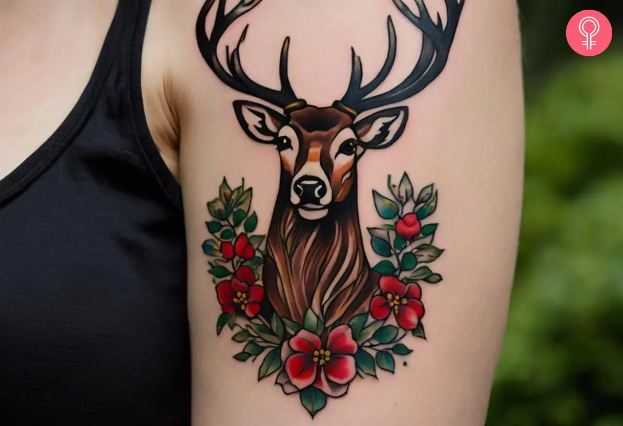 Woman with a Scottish stag tattoo on the upper arm