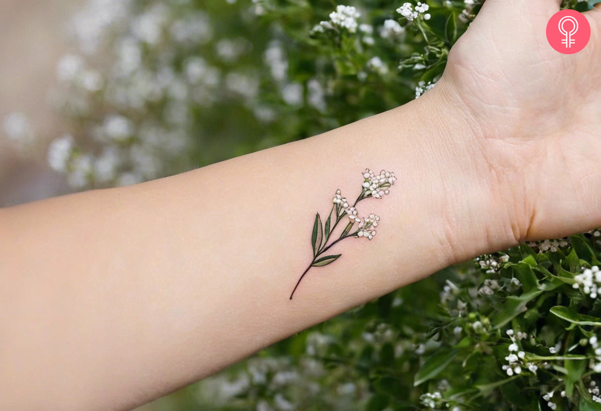 Small baby’s breath tattoo on a woman’s wrist