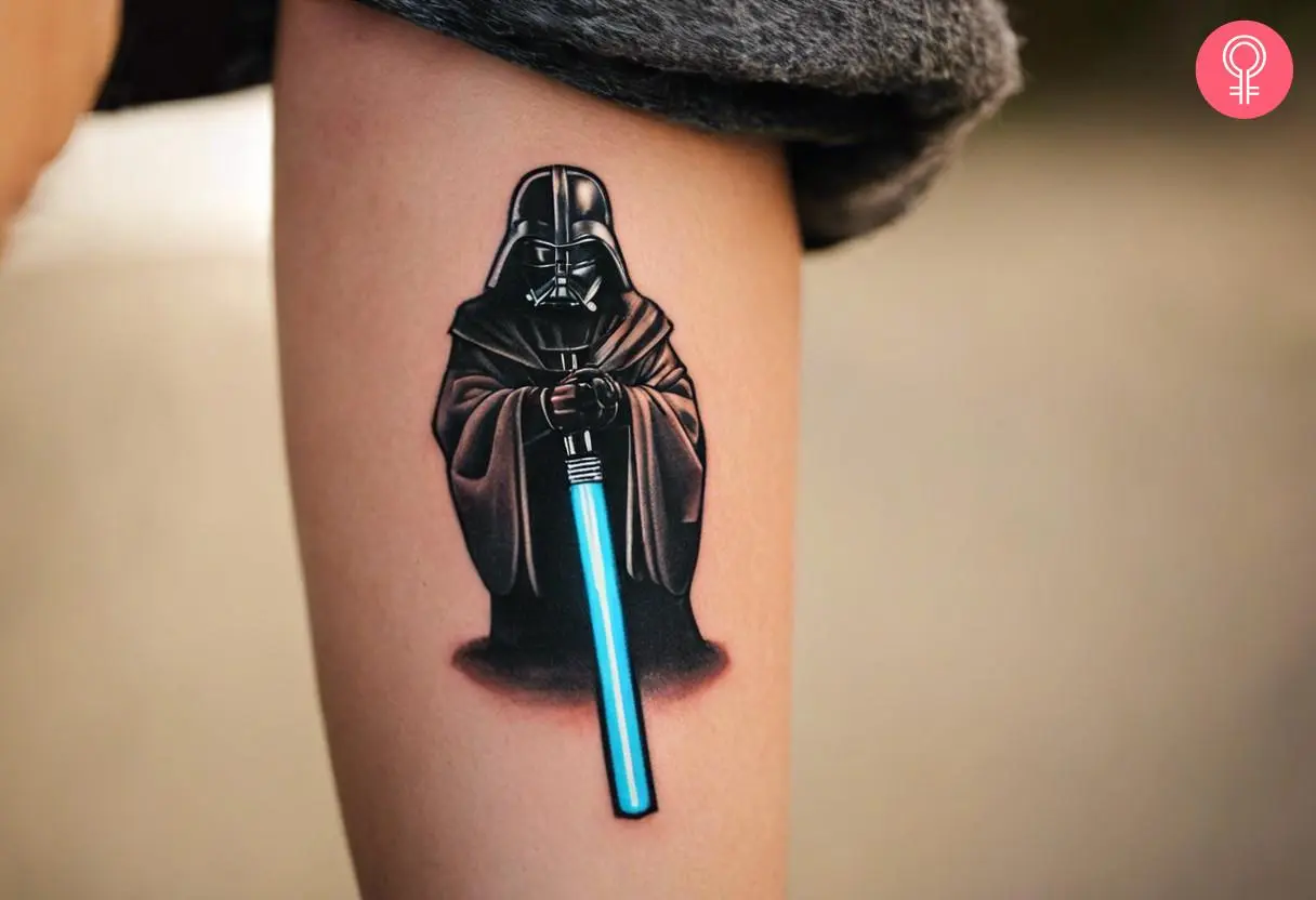 Small Lightsaber tattoo on a woman’s forearm