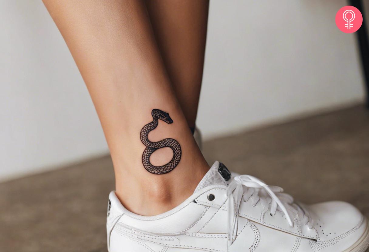 Small snake tattoo on ankle