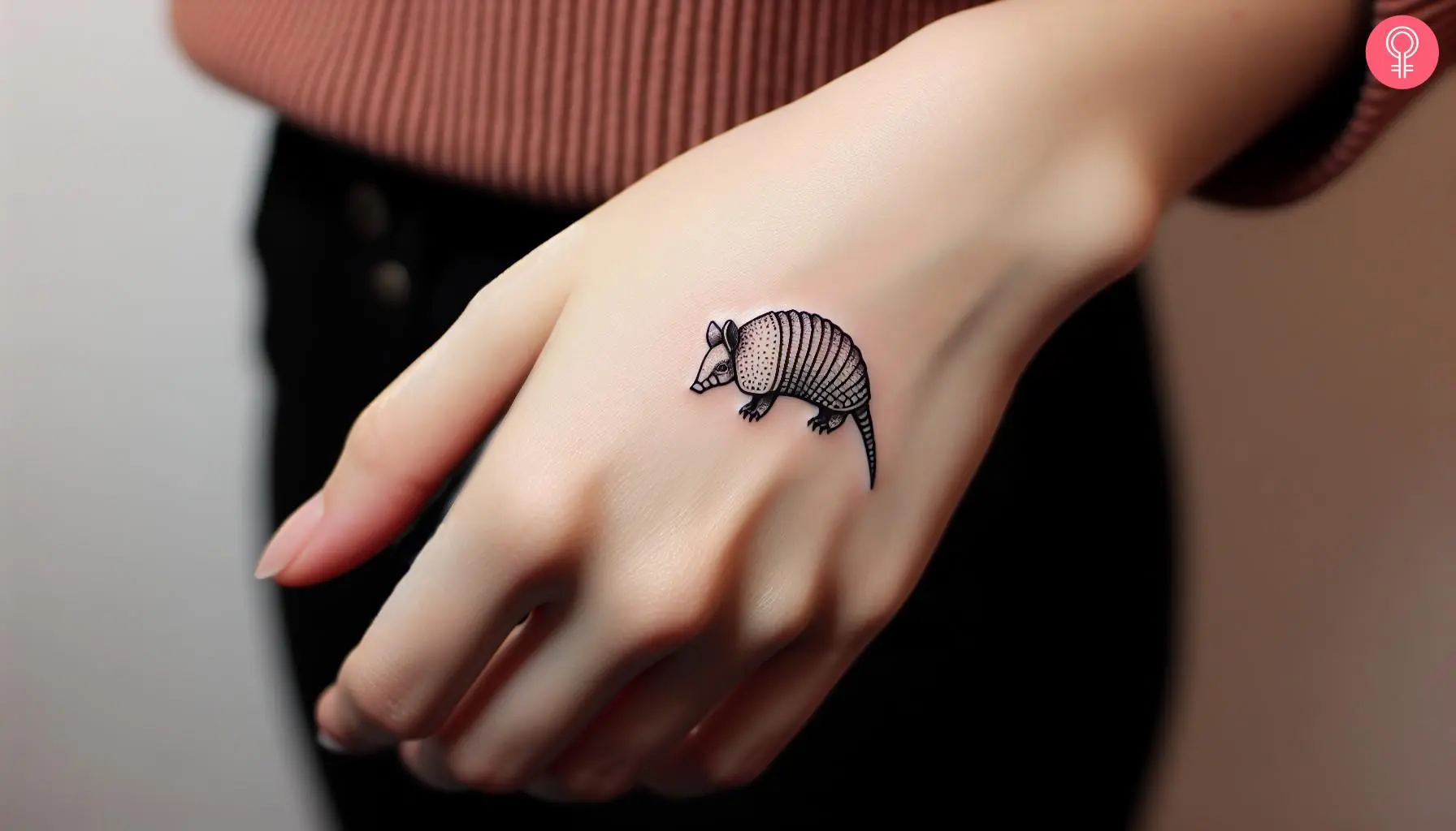 Small armadillo tattoo on the back of the hand