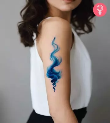 A clock and rose tattoo on a woman’s forearm