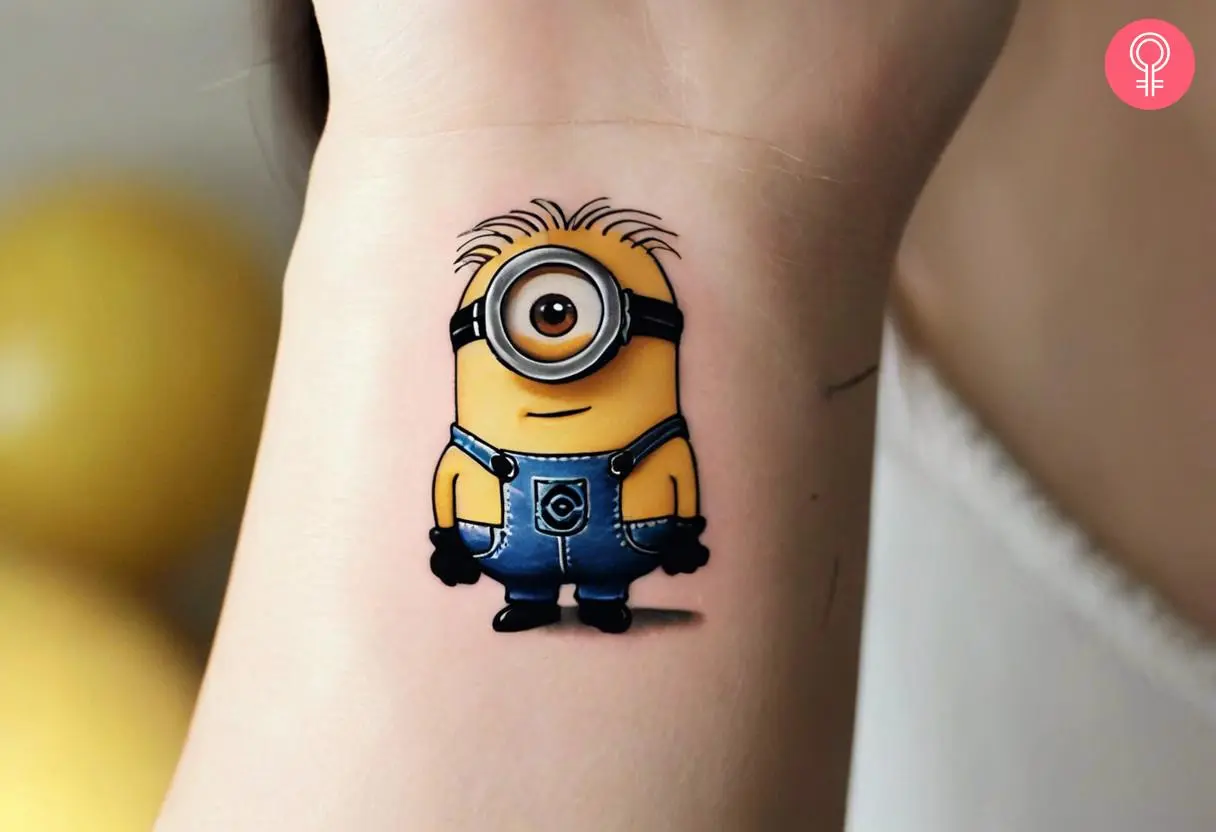 Stuart minion tattoo on the wrist of a woman