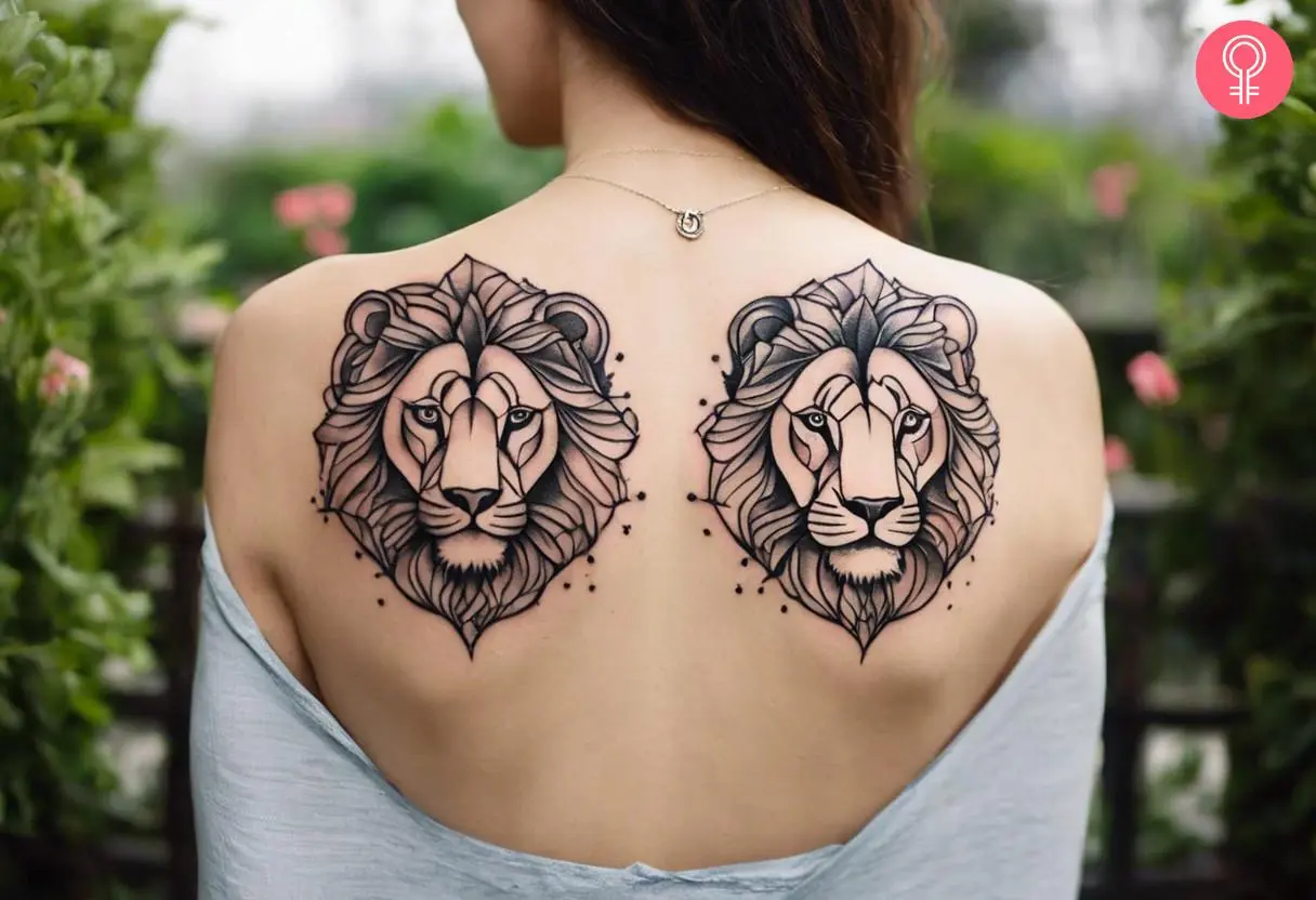 Symmetrical lion back tattoo on a woman