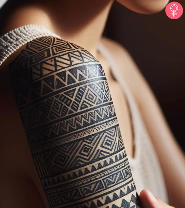 Taino tribal tattoo patterns on the arm of a woman